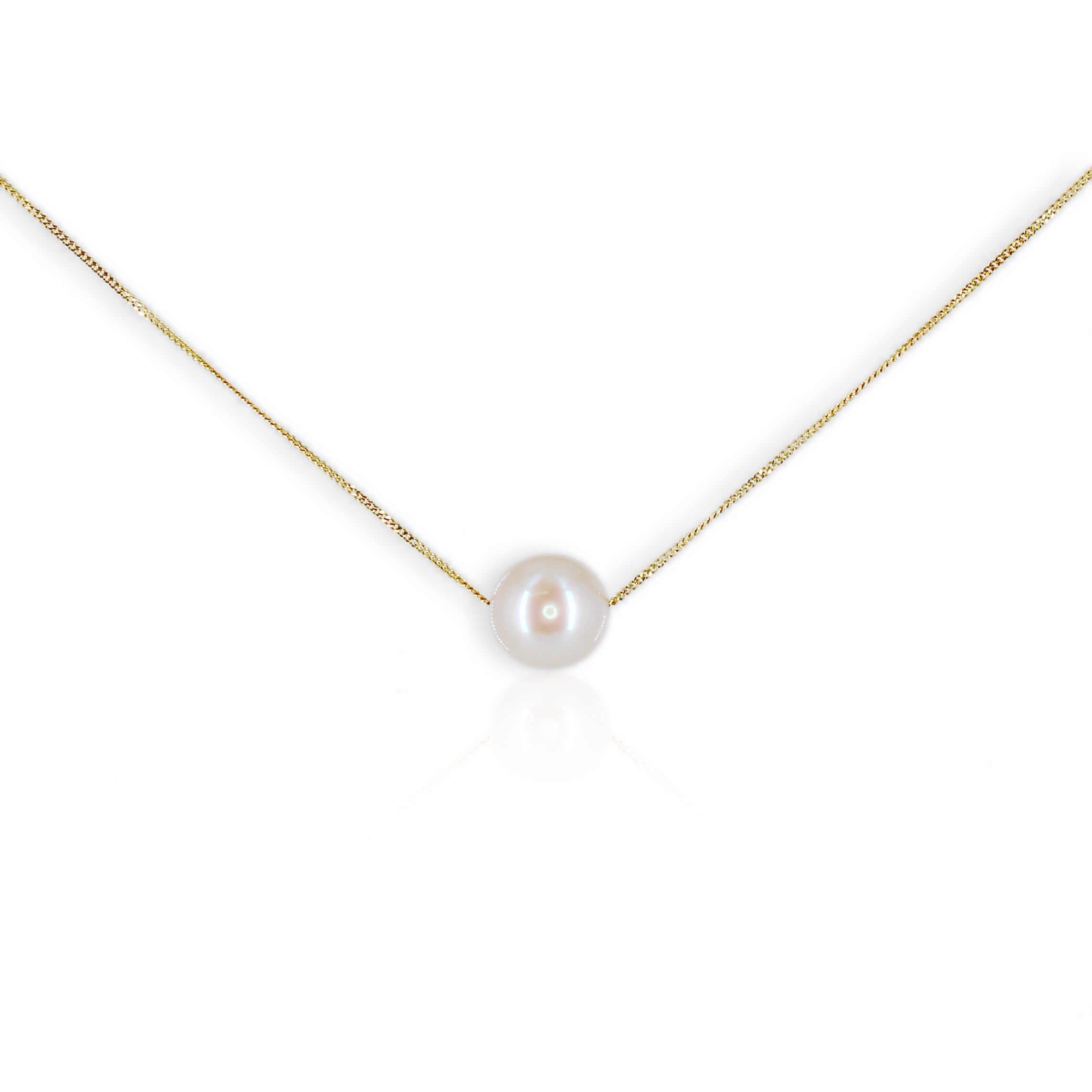 Pearl necklace on a gold chain against a white background